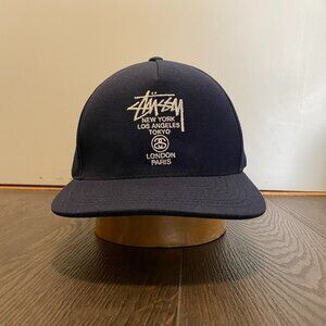 STUSSY WORLD TOUR SNAP BACK HAT PREOWNED NAVY OS